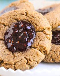 These soft and chewy 7-ingredient Healthy Thumbprint Cookies are so simple and delicious, you'd never know they're refined sugar free, gluten free, dairy free, and vegan! Healthy Dessert Recipes with low calorie, low fat, high protein, high fiber, and raw options at the Desserts With Benefits Blog (www.DessertsWithBenefits.com)