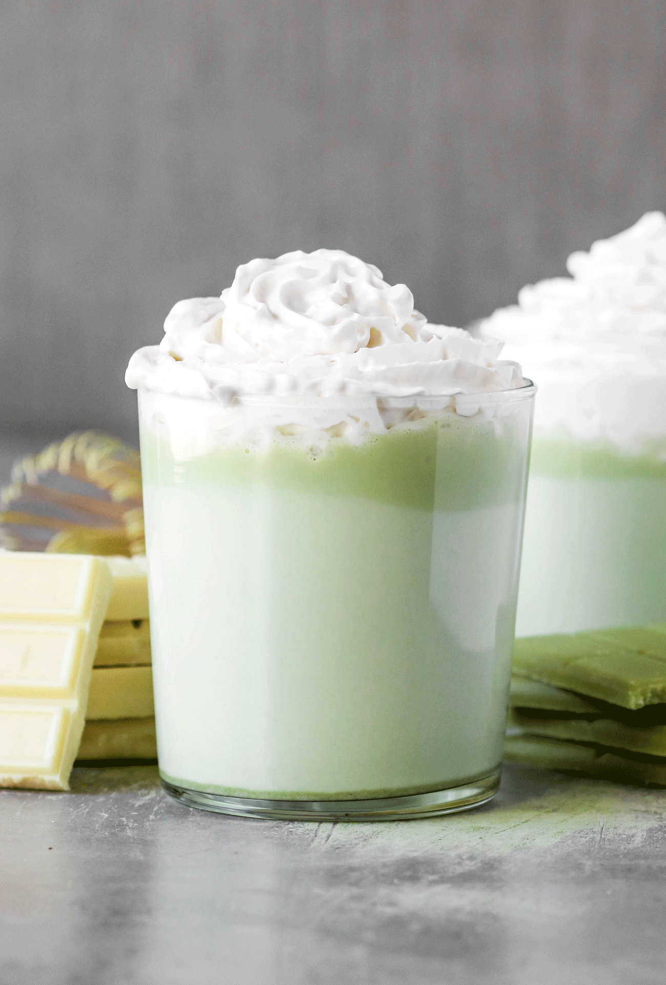 Swap out regular Hot Chocolate with this unique, fun, and sophisticated Matcha Green Tea White Hot Chocolate -- it'll be your new favorite winter treat. It's sugar free, low carb, and gluten free too! #sugarfree #lowcarb #healthychocolate #hotchocolate #healthydessert #hotchocolaterecipe #glutenfree #matchachocolate #healthymatcharecipes #matchadessert #matchatea